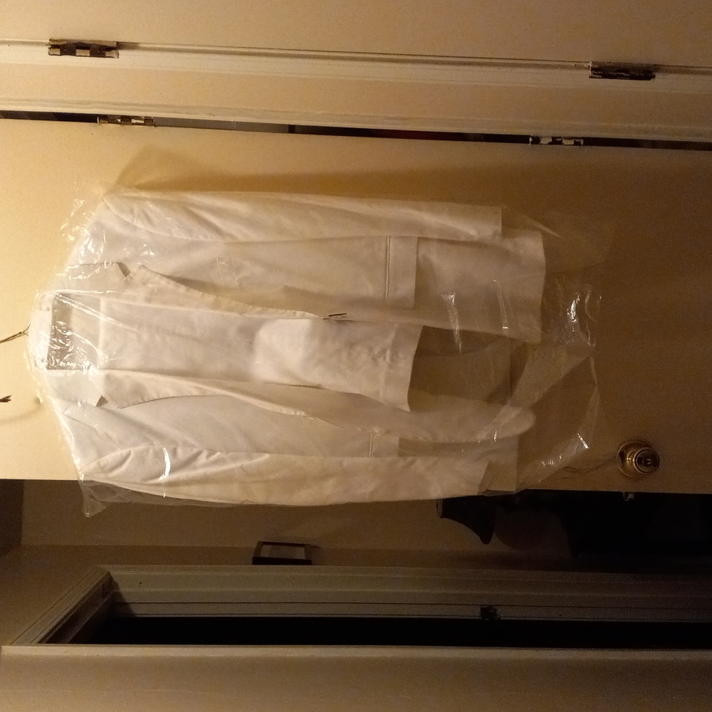 Man's white dress suit coat and pants